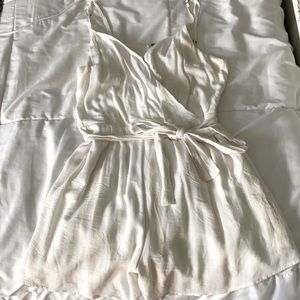 Cream romper with tan stripes and belt